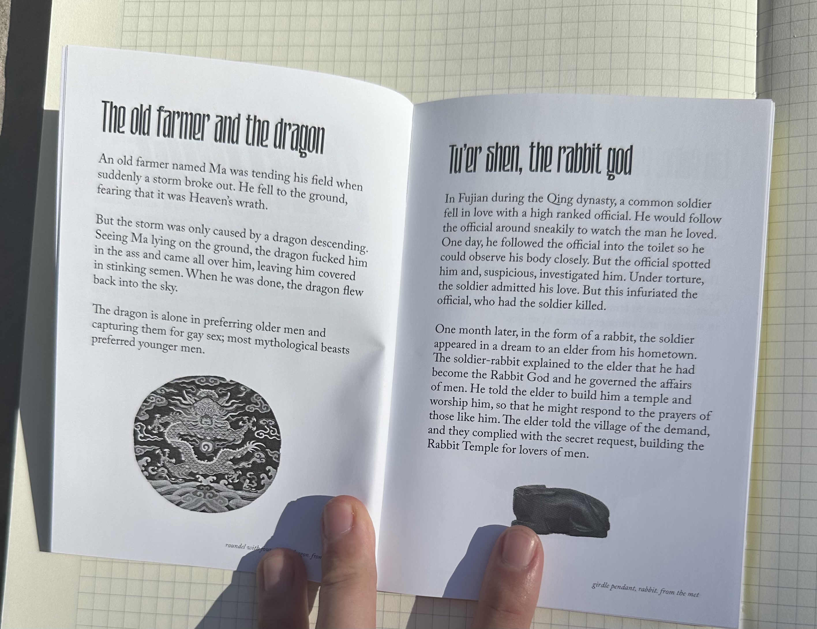 the inside of the zine. on the left page is an entry titled the old farmer and the dragon. it also has an image of a dragon roundel. on the right page is an entry titled tu'er shen the rabbit god. it also has a stone rabbit image at the bottom.